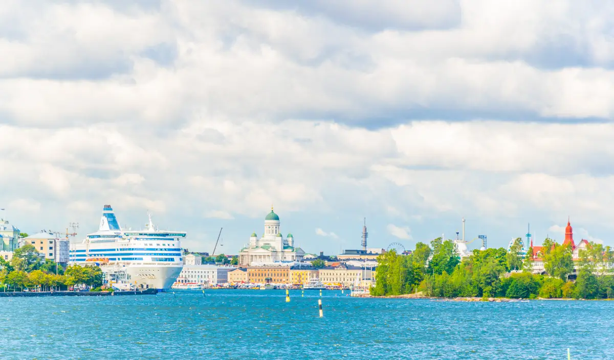 Scenic view of Helsinki port with a cruise ship and the iconic Helsinki Cathedral in the background, Finland